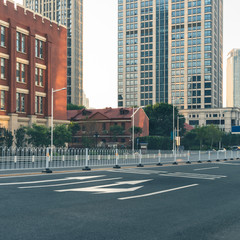 empty road and modern office block buildings against sky,Tianjin,China.
