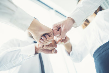 The business people greeting with a fist