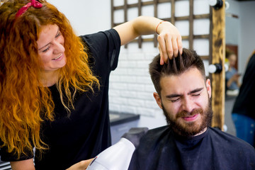 Stylist finishes haircut