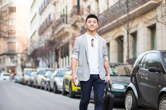 Chinese businessman walking down the street
