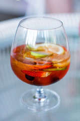 Mix fruits tea in glass. Welcome drink in tropical luxury hotel. Homemade beverage from fresh fruit in tea.