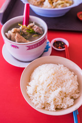 Pork Spare Ribs Soup with Rice on red table background