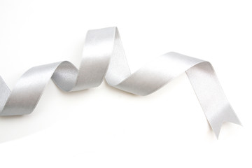 silver ribbon bow in bright silver white grey color isolated