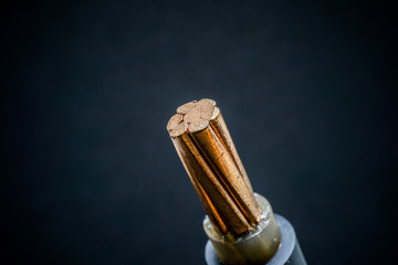 Wire and copper with black background in the studio.