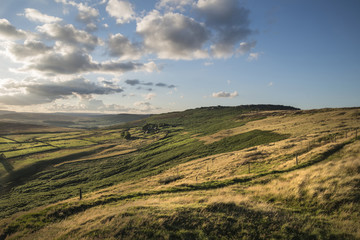 Fototapeta premium Beautiful vibrant landscape image of Burbage Edge and Rocks in Summer in Peak District England