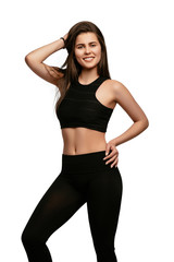 Fototapeta premium Beautiful smiling happy slim young sporty fitness woman