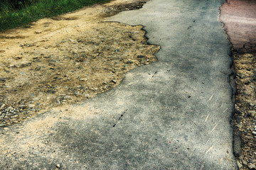 Background texture road pothole pothole with puddles on asphalt road close-up hdr