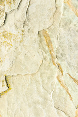 Photo texture relief of a sandstone stone close-up under the background and an inscription