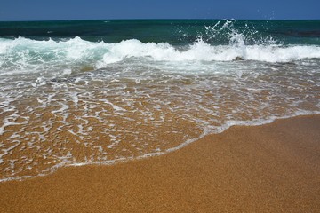 Beautiful clean sea and waves. Summer background for travel and holidays. Greece Crete.. Amazing scenery on the beach.