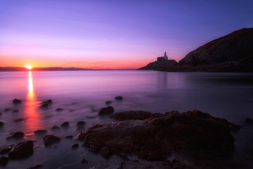 Fototapeta premium A calm morning at Mumbles lighthouse in Swansea, South Wales, UK
