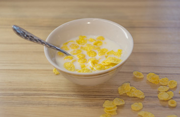 a small Cup of milk with grains is on the table