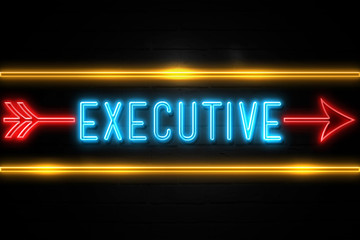 Executive  - fluorescent Neon Sign on brickwall Front view