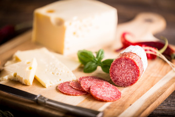 Dry salami or sausage with cheese and herbs