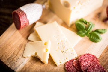 Dry salami or sausage with cheese and herbs