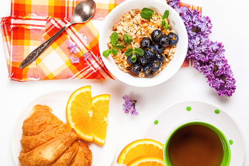  Muesli, blueberry, juice, tea and croissant