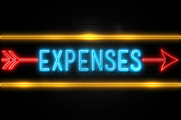 Obraz premium Expenses - fluorescent Neon Sign on brickwall Front view