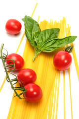 Pasta with cherry tomatoes on a white background