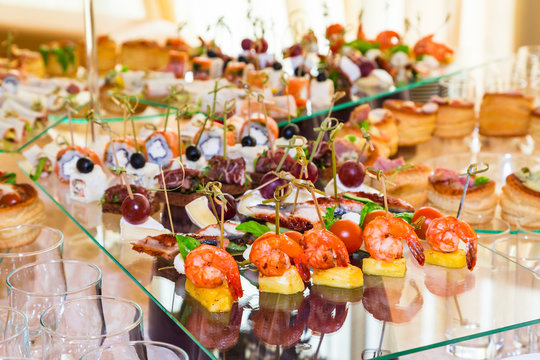 Snacks, fish and meat specialities on the buffet. Desserts. A gala reception. Served tables. Catering.