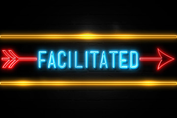 Obraz premium Facilitated - fluorescent Neon Sign on brickwall Front view