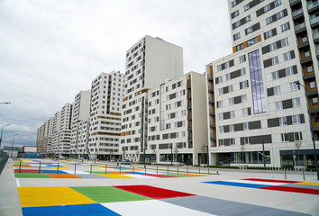 Modern luxury residential blocks with colorful parking. - obrazy, fototapety, plakaty