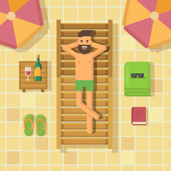Man relaxing on a chaise lounge at poolside