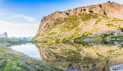 Reflections of rocks and mountains in the lake