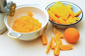 Fototapeta na wymiar Ingredients for pumpkin jam - minced pumpkin and orange 