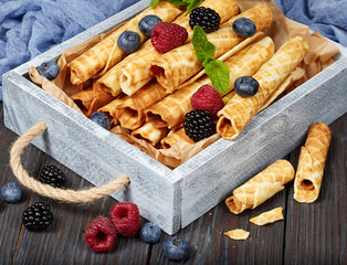 Delicious waffle rolls with berries