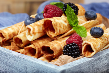 Delicious waffle rolls with berries