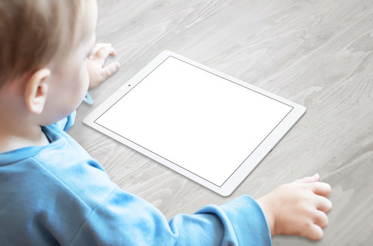 Baby With Pacifier Watching Tablet With Isolated Screen For Mockup.