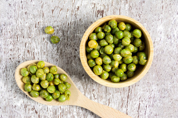 dried Sugar Peas in wood bowl.top view