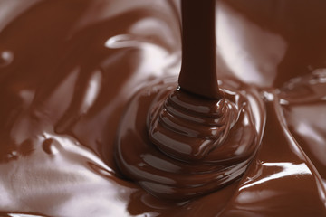 pouring melted premium dark chocolate