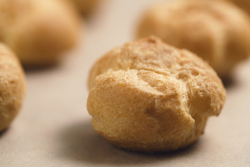 profiteroles on brown paper closeup