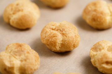 profiteroles on brown paper closeup