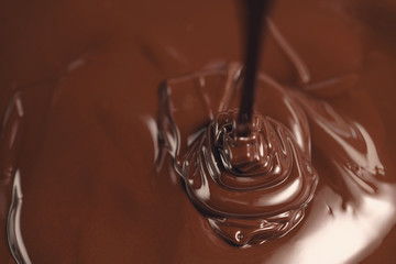 pouring melted premium dark chocolate from above