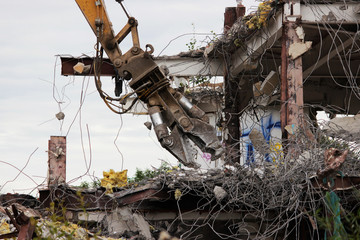 Industrial dismantle, mechanical destruction. Dismantling of the building with the help of heavy...