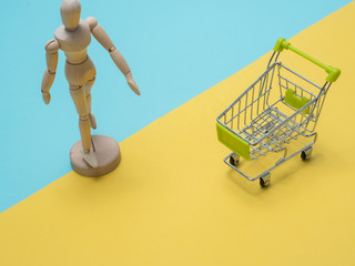 Collection of shopping cart  full of shopping time.Top view or flat lay composition cart on color background.