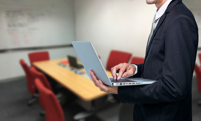 Businessman hold laptop computer