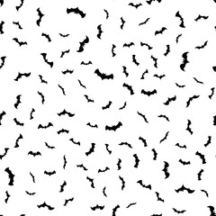 Seamless pattern with black bats of different shapes on a white background. Design for a happy Halloween. Vector illustration.