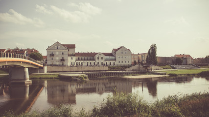 View on bridge and embankment of Warta river in polish town Konin.