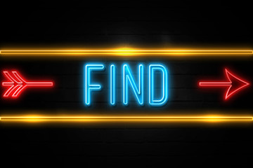 Obraz premium Find - fluorescent Neon Sign on brickwall Front view