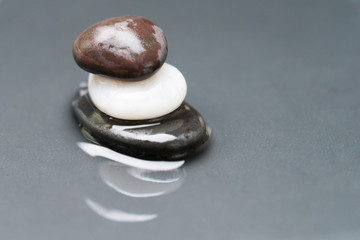 Spa stones on wet surface