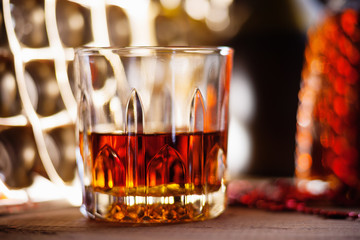 Glass of brandy on the wooden table 