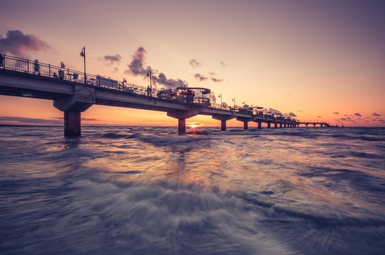 Fototapeta Pier in Miedzyzdroje resort - Baltic seascape at sunset, Poland