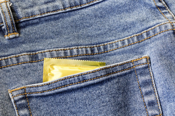 condom in blue jeans pocket