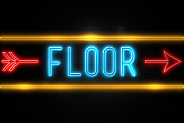 Obraz premium Floor - fluorescent Neon Sign on brickwall Front view