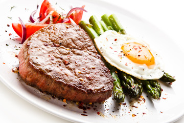 Grilled steak with asparagus and fried egg 