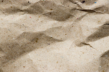 Wrinkled brown kraft paper textured background used as design element or decoration