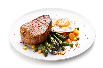 Grilled steak with asparagus and fried egg 