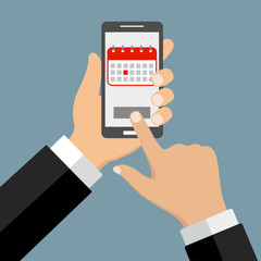 phone with calendar in hand